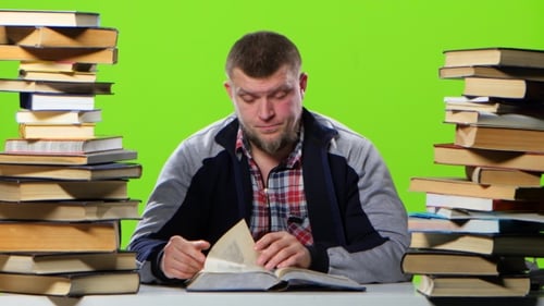 Man Sitting at the Table Begins To Fill Up. Green Screen