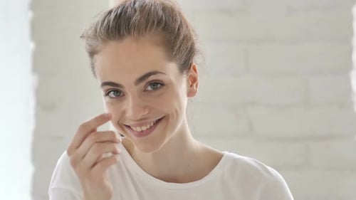 Inviting Young Woman in Office