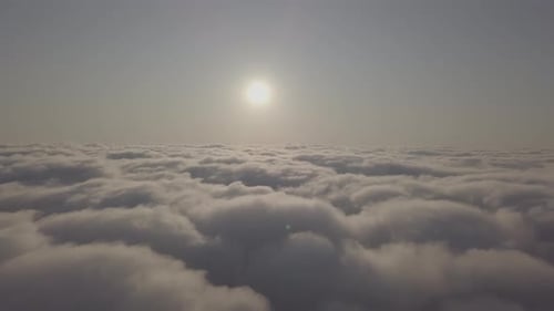 View From a Drone on a Sea of Clouds to the Horizon at Dawn