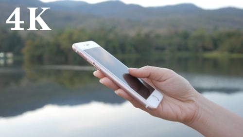 Woman Using Smartphone With Nature Reflection