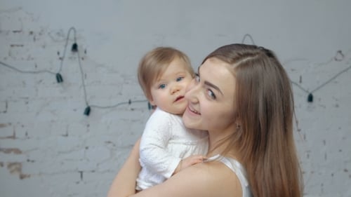 Mother with Her Newborn Baby. Mother Is Holding Her Little Baby Girl