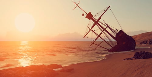 Golden Sunset Over Shipwreck on Sandy Beach