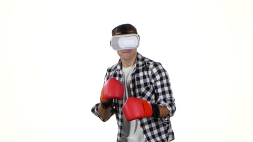 Young Man Boxing in Virtual Reality with Gloves
