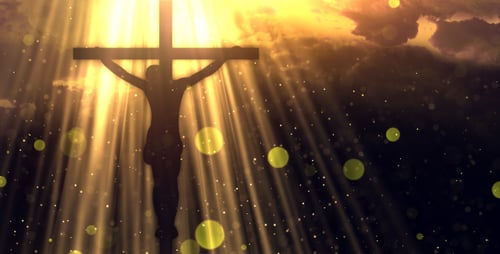 Religious Cross Silhouette with Golden Light Rays and Particles