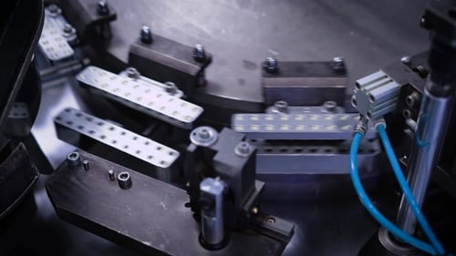 Automatic Production Line at a Pharmaceutical Company. The Machine Fills the Capsule with Contents.