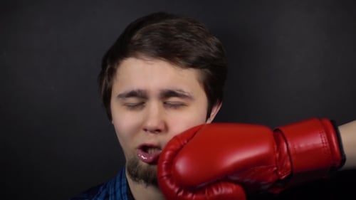 Man Gets Punched in the Face by Glove