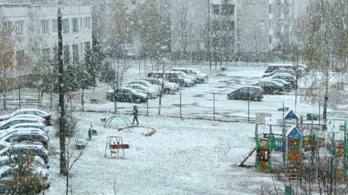 Passersby in the Snowstorm