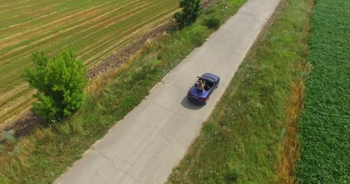 Friends Driving On Summer Road Trip