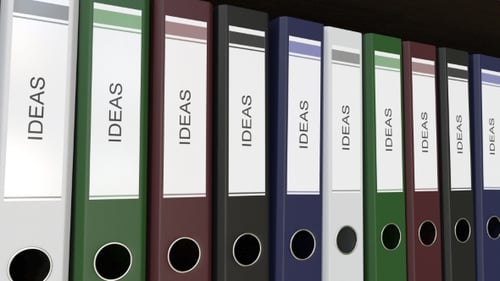 Line of Multicolor Office Binders with Ideas Tags