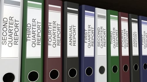Line of Multicolor Office Binders with Quarter and Annual Reports Tags