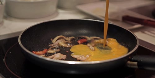 Making Omelet on a Kitchen Stove Close Up