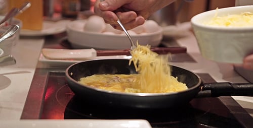 Chef Prepares Delicious Omelet in Frying Pan