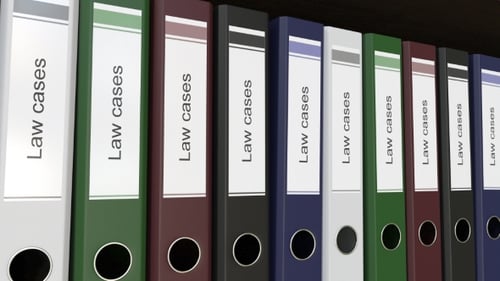 Line of Multicolor Office Binders with Law Cases Tags