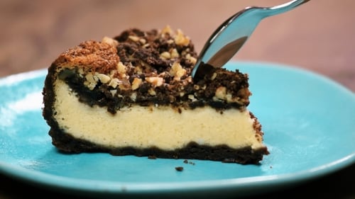 Eating a Slice of Rich Cheesecake with Fork