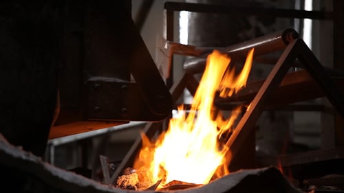 Intense Fire Burning Inside Metal Industrial Structure