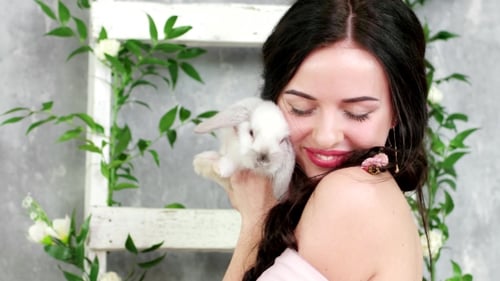 Portrait of Happy Smiling Woman Holding White Cute Long-eared Rabbit, Spring Photo Session