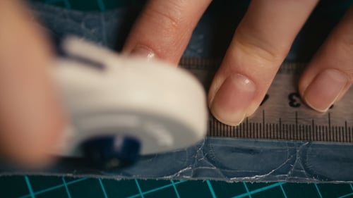 Hands Cut Material with Ruler and Rotary Cutter