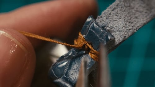 Leather Product Constructed with String