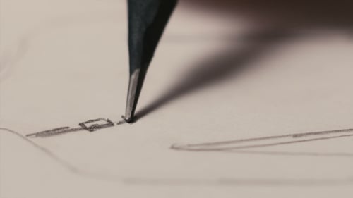 Pencil Draws Lines on White Paper, Close Up