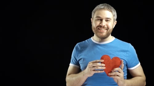 Man Offering a Red Heart With a Smile