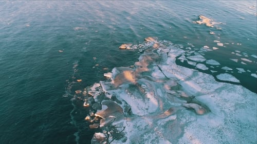 Aerial View Frozen Shapes of Ice Floating on Lake Ladoga