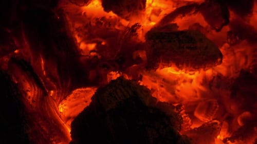 Close-Up of Burning Embers and Wood at Night