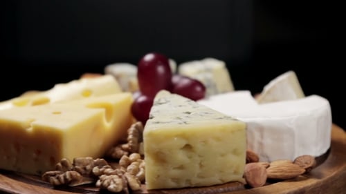 Artistic Cheese Board Display with Fruit and Nuts