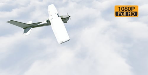 Small Airplane Flying Through Clouds