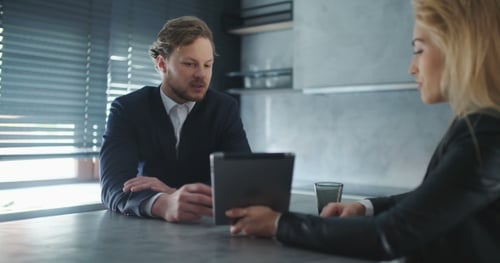 Business People Discussion Over Tablet Computer In Office