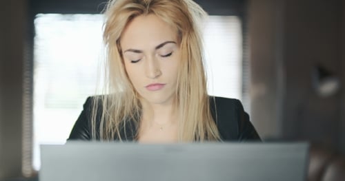 Tired Young Businesswoman Working In Office