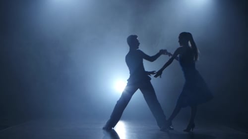 Dance Tango Performed By Professional Couple in Smoky Studio, Silhouette
