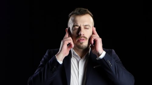 Businessman in Black Suit Suffers From Headache and Does Massage