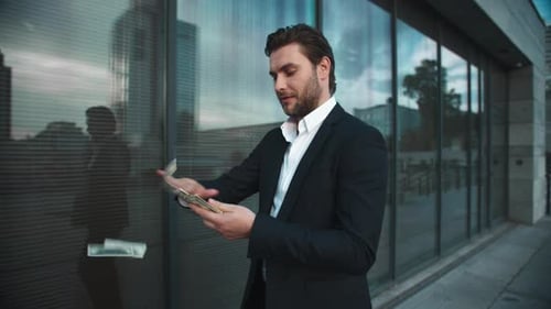 Businessman Throwing Money Cash on Street. Manager Celebrating Victory with Cash
