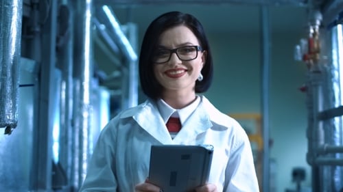 A Woman in a Plant with Digital Tablet
