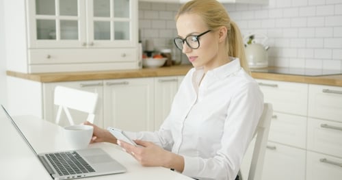 Successful Young Woman Using Devices