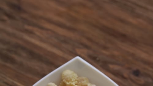Close Up of Cornflakes in a White Bowl