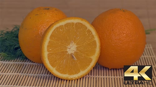 Close Up of Oranges with Green Herbs