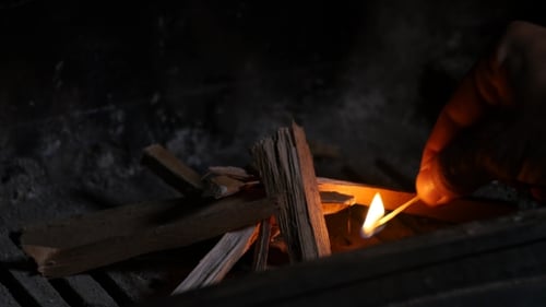 Man Starts Fire in Fireplace