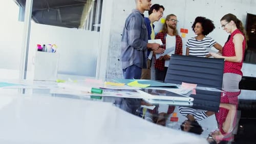 Diverse Team Collaborates in Modern Office Environment