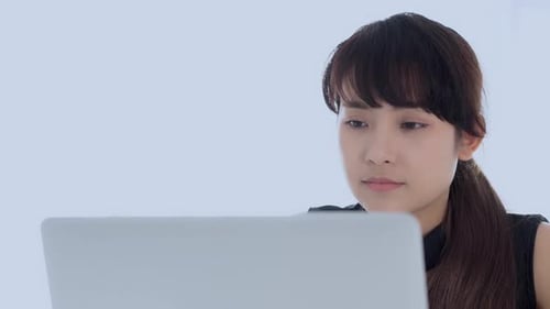 Woman Working on Laptop Computer Close Up