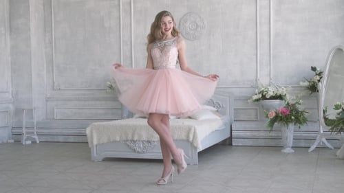 Woman Modeling Pink Dress in Room