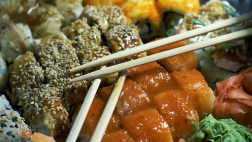 Different Types of Appetizing Sushi in Plastic Containers