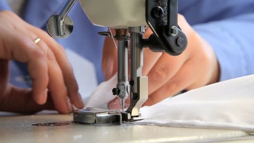 Close Up Sewing Machine Stitching White Fabric