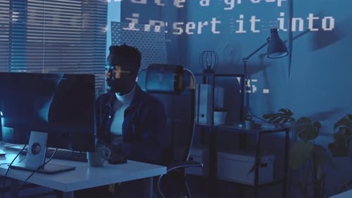 African-American Programmer Working at Night
