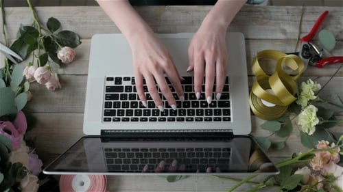 Top View Florist Table with Laptop, Flower Shop Workplace, Laptop, Beautiful Flowers, Computer on