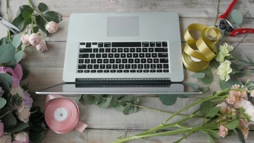 Top View Florist Table with Laptop, Flower Shop Workplace, Laptop, Beautiful Flowers, Computer on