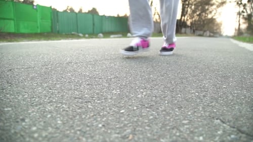 Woman Running on the Road