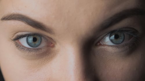 of the Blue Eyes of a Beautiful Young Woman