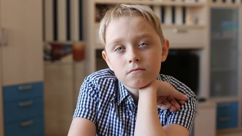 Close Up of Pensive Blonde Haired Child
