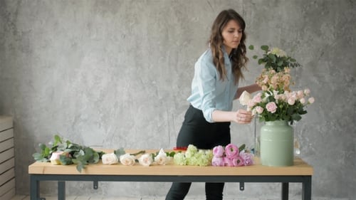 Woman Arranging Beautiful Flower Bouquet